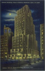 Carte postale colorisée montrant l’édifice Aldred la nuit.