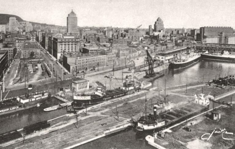 Vue aérienne montrant l’entrée du canal de Lachine et la partie ouest du Vieux-Montréal