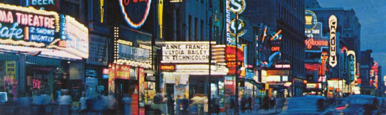 Carte postale colorisée montrant la rue Sainte-Catherine de nuit avec les néons.