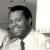 Édouard Anglade, premier policier noir du Service de police de la Ville de Montréal, et une collègue.