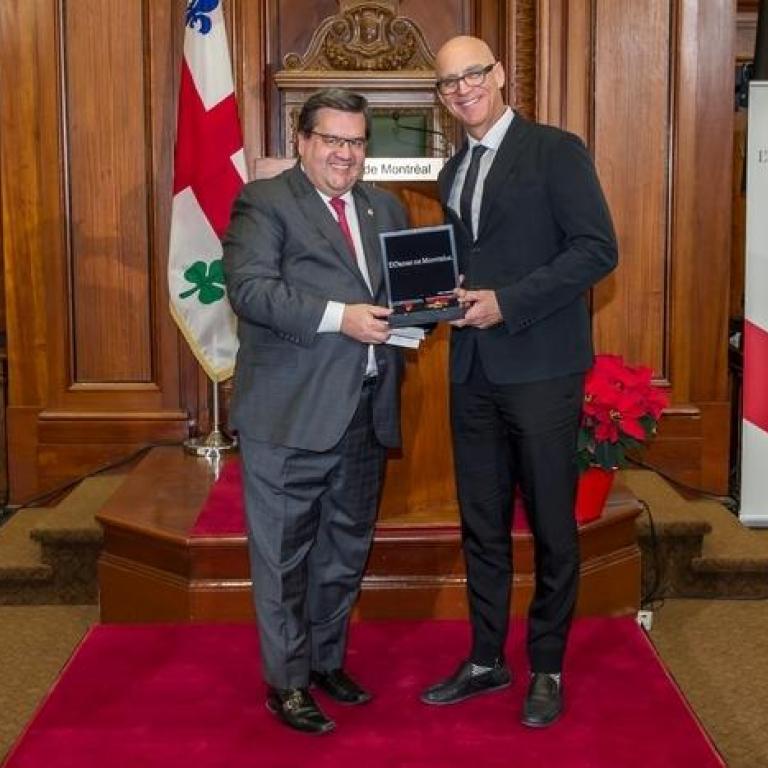 The mayor of Montreal Mr Denis Coderre and Mr François Plamondon, representing Mr Guy Laliberté  Great Montrealer 2001 recepient of the title of Commander