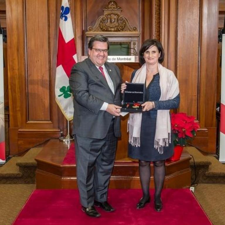 The mayor of Montreal Mr Denis Coderre and Mrs Célile Arbaut representing Father Emmett Johns Great Montrealer 2002 recepient of the title of Commander