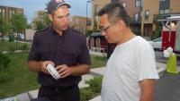 Fire safety educator with Montréal resident during a public awareness activity