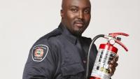 Prevention officer with a portable fire extinguisher