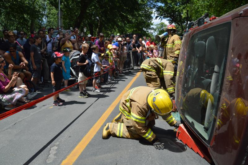 Firefighters demonstrate extrication to onlookers