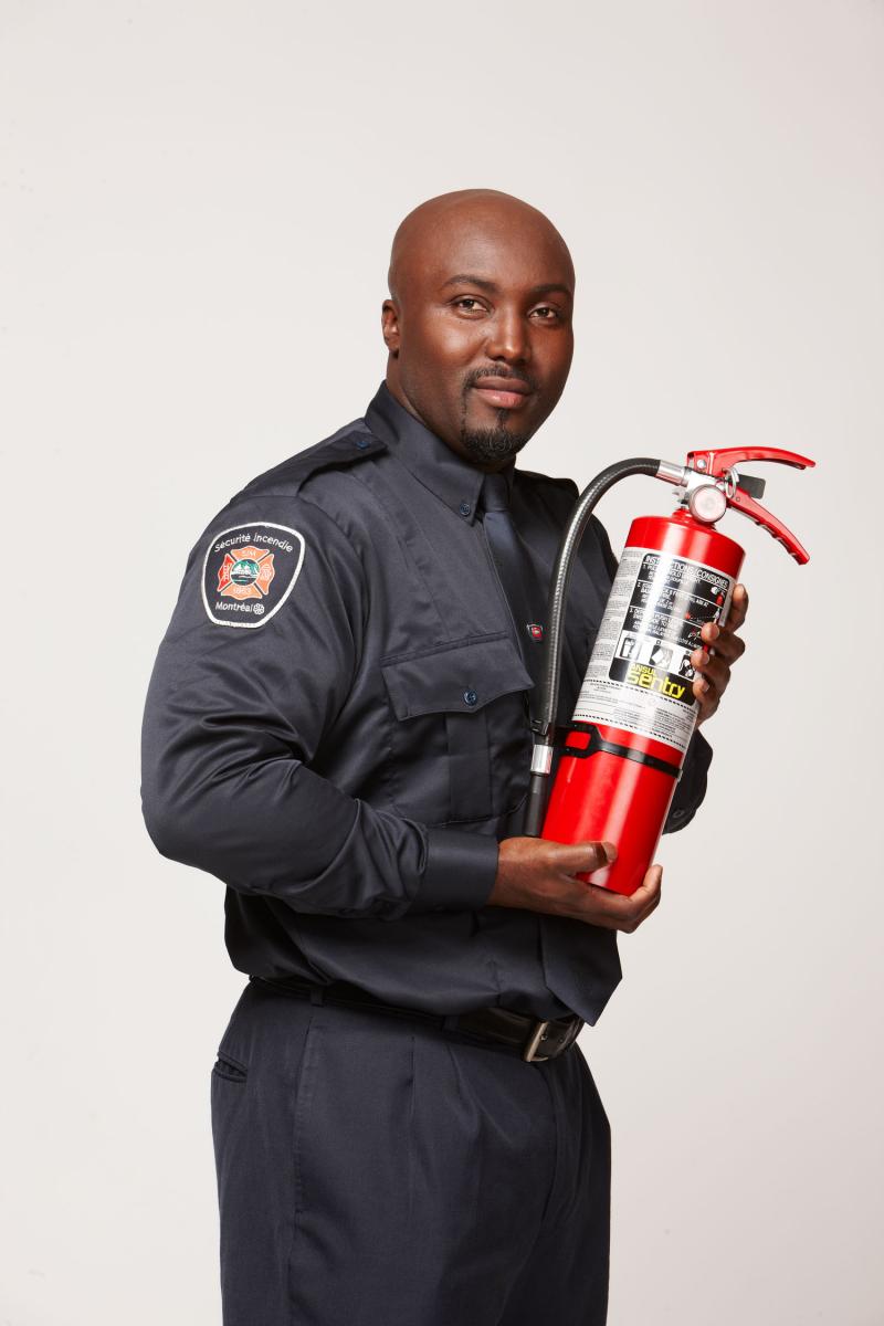 Prevention officer with fire extinguisher