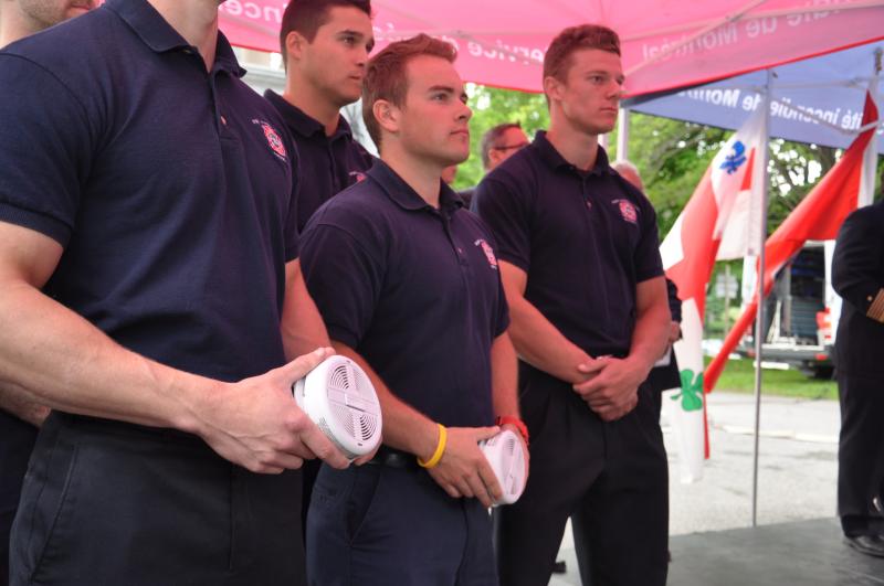 Firemen look on during the launch of the third annual Smoke Alarm Brigade