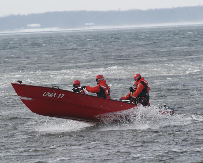 Ice rescue team in a boat during a simulation